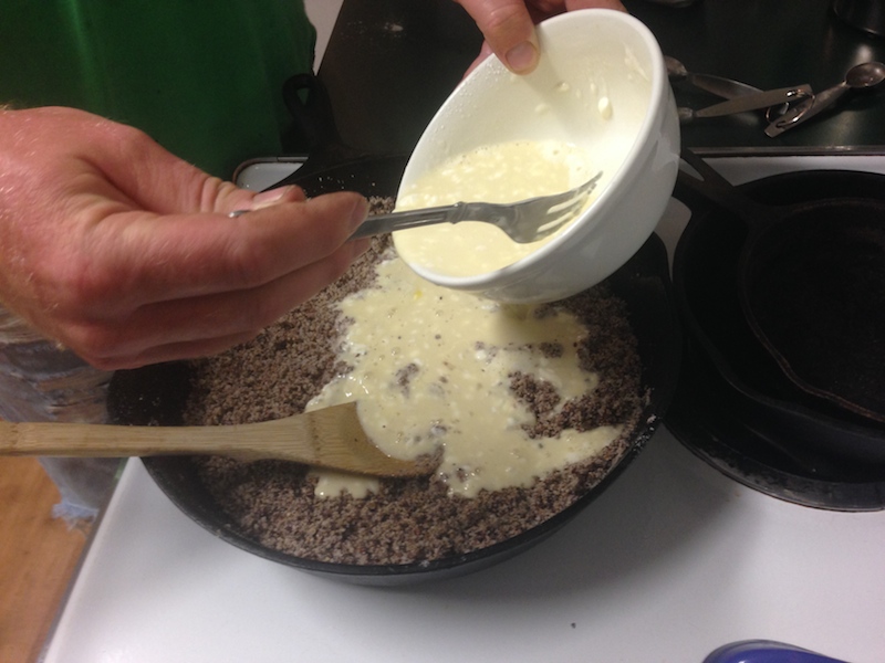 ADDING THE BATTER TO THE TOASTED CORNMEAL